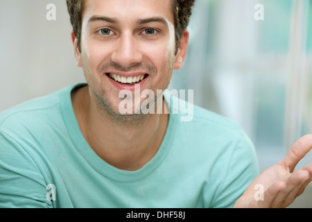 Young man smiling at camera Stock Photo