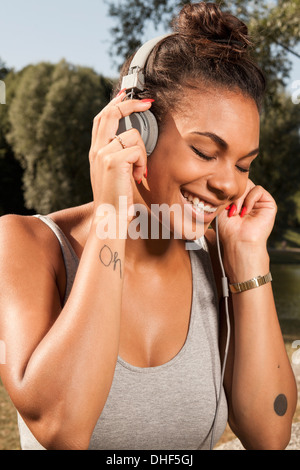 Young woman enjoying music on her headphones