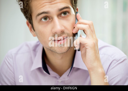 Young man on mobile phone Stock Photo