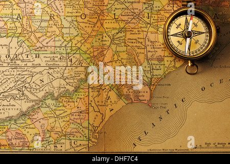 Antique compass over old XIX century map Stock Photo