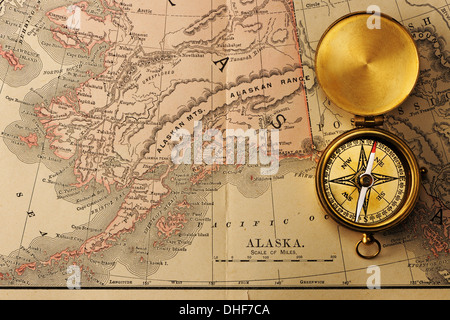 Antique compass over old XIX century map Stock Photo