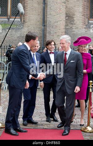 The Hague, The Netherlands. 8th Nov, 2013. King Philippe(Filip) (C) and Queen Mathilde of Belgium (R) visit Prime Minister Mark Rutte of The Netherlands at Palace Noordeinde in The Hague, The Netherlands, 8 November 2013. Photo: Patrick van Katwijk / NETHERLANDS AND FRANCE OUT/dpa/Alamy Live News Stock Photo