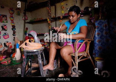 A young Panamanian paints a craft at a ceramic workshop in the town of Chitre Peninsula de Azuero Herrera province Republic of Panama Stock Photo
