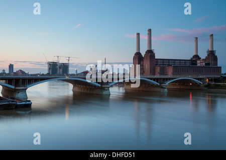 Dawn at Battersea Power Station and Railway Bridge, London, England. Stock Photo