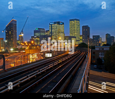 View of Canary Wharf skyscrapers showing DLR train tracks in foreground, London, England, United Kingdom Stock Photo