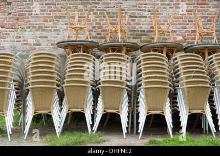 Heap of chairs and tables, ready for use at the outdoor terrace Stock Photo