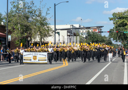 Buchholz High School marching band, yellow and black costumes marching in University of Florida 2013 Homecoming Parade, USA. Stock Photo