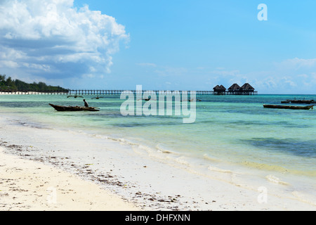 Hotel Jetty and traditional Dhow boats, Indian Ocean, Bwejuu Beach, Zanzibar, Tanzania, Eest Africa Stock Photo