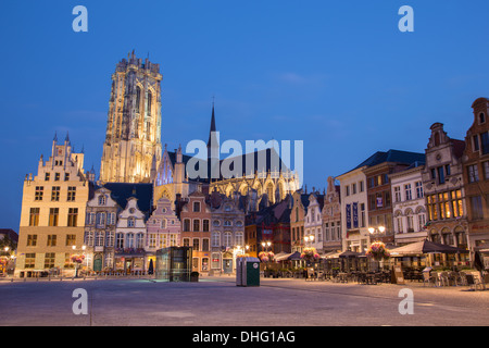 MECHELEN - SEPTEMBER 4: Grote markt and St. Rumbold's cathedral in evenig dusk in Sepetember 4, 2013 in Mechelen, Belgium. Stock Photo