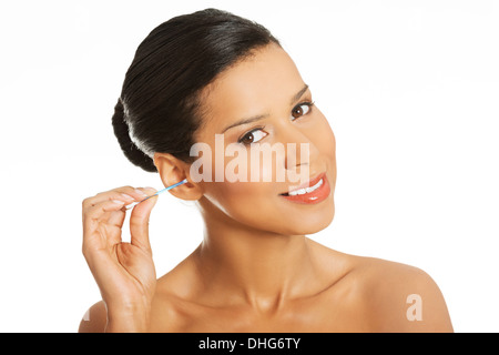 Attractive woman with ear stick. Isolated on white.  Stock Photo