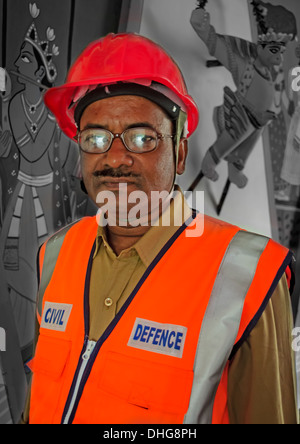 Portrait of a Civil Defence Volunteer inside a Pandal for Goddess Durga Worship, Calcutta, Bengal, India Stock Photo