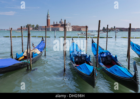 Beautiful gondolas parked at the side of Grand Canal Venice, Italy in the summer