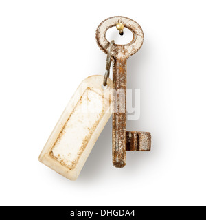 Old key and dirty key fob hanging on nail against white background, clipping path included Stock Photo
