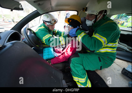 Paramedics stabilising C Spine of car crash casualty SIMULATION Stock Photo