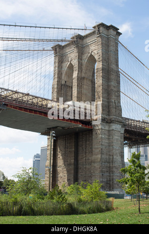 General view of the Brooklyn Bridge as seen from ground level on the Brooklyn side of the East River in New York. Stock Photo