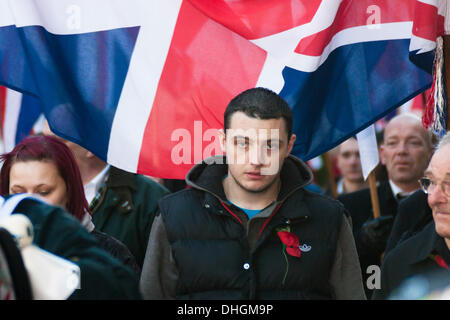 London, UK. 10 November 2013. A member of the right wing National Front marches to the Cenotaph after the main Remembrance Day ceremonies, to lay a wreath. Credit:  Paul Davey/Alamy Live News Stock Photo