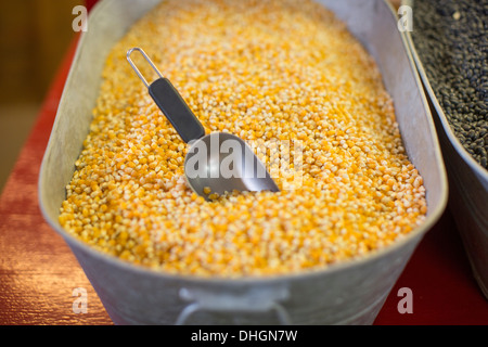 Popping corn in a large metal container at a road side store in Texas.