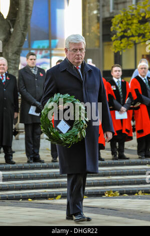 Belfast, Northern Ireland. 10th Nov 2013 - Eamonn Gilmore lays a wreath at the Cenotaph at Belfast City Hall in remembrance of those soldiers killed during WW1, WW2 and other wars and conflicts. Credit:  Stephen Barnes/Alamy Live News Stock Photo