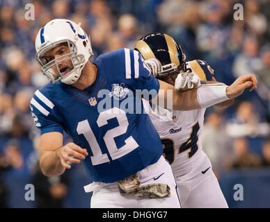 Indianapolis, OH, USA. 10th Nov, 2013. November 10, 2013: St. Louis Rams defensive end Robert Quinn (94) hits Indianapolis Colts quarterback Andrew Luck (12) as he throws the ball during the NFL game between the St. Louis Rams and the Indianapolis Colts at Lucas Oil Stadium in Indianapolis, IN. © csm/Alamy Live News Stock Photo