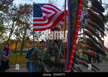 Washington, District of Columbia, US, USA. 10th Nov, 2013. JAKE SINGER, a Vietnam veteran from the Navajo Nation in Arizona, holds the feathered ''Eagle Staff'' as he leads other Native American veterans on a walk from the Pentagon to the Vietnam Women's Memorial. © Miguel Juarez Lugo/ZUMAPRESS.com/Alamy Live News Stock Photo