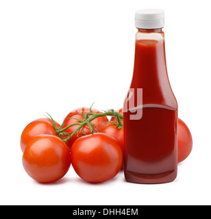 Ketchup bottle and fresh tomatoes isolated on white Stock Photo