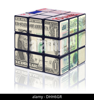 A puzzle cube with banknotes on each side featuring - American Dollar, British Pound and the Euro.
