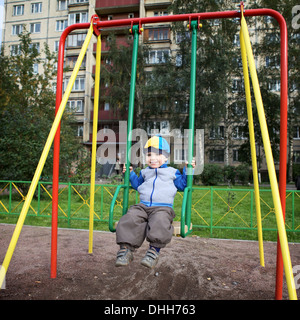 Boy Playing on Playground Stock Photo