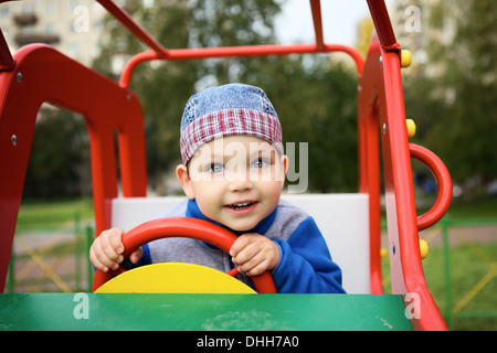 Boy Playing on Playground Stock Photo