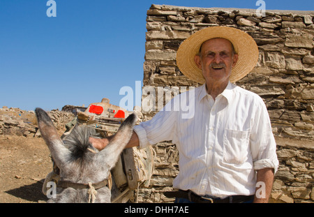 Greece Paros Cyclades old local man with donkey near Lefkes in mountains at his farm home 8 Stock Photo