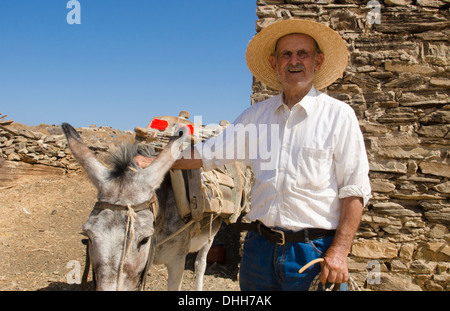 Greece Paros Cyclades old local man with donkey near Lefkes in mountains at his farm home 8 Stock Photo