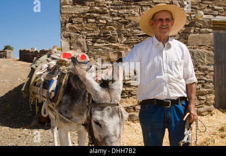 Greece Paros Cyclades old local man with donkey near Lefkes in mountains at his farm home 8 Stock Photo