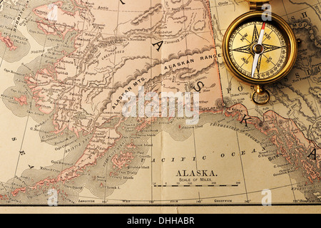 Antique compass over old XIX century map Stock Photo