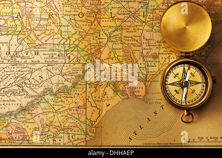 Antique compass over old XIX century map Stock Photo
