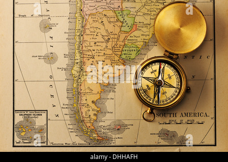 Antique compass over old XIX century map Stock Photo