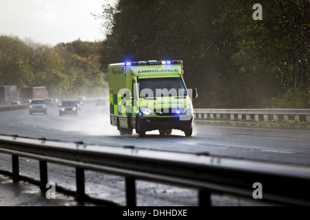 British ambulance on a UK motorway Stock Photo