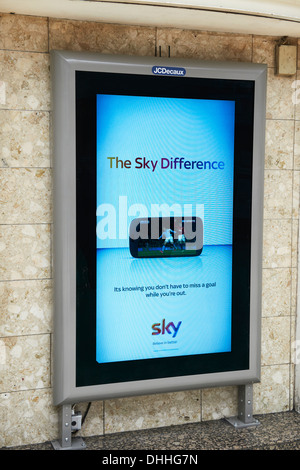 Electronic poster site at Charing Cross Station with a Sky tv advert on it Stock Photo