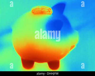 Thermal photograph of piggy bank with coin Stock Photo