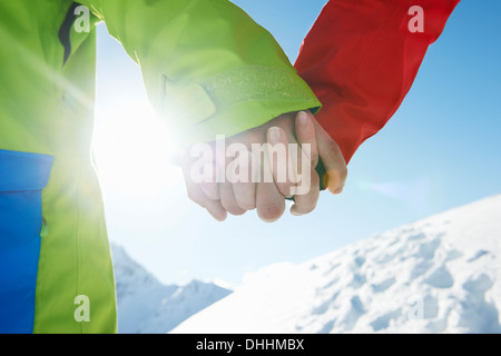Couple holding hands, close-up, Kuhtai, Austria Stock Photo