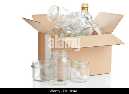 Collected glass bottles in carton box for recycling on white background Stock Photo