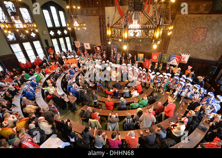 Erfurt, Germany. 11th Nov, 2013. Members of different carnival associations sway to and fro before the beginning of the carnival council session in front of the townhall in Erfurt, Germany, 11 November 2013. Photo: Marc Tirl/dpa/Alamy Live News Stock Photo