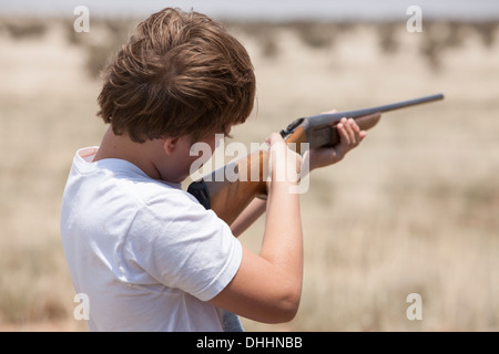 Boy with rifle, Texas, USA Stock Photo