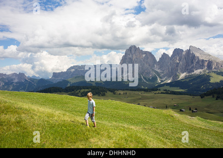 Boy walking up hill, Alto Alige, South Tyrol, Italy Stock Photo