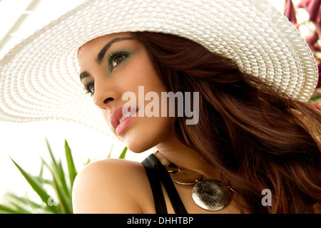 Portrait of young woman, wearing sun hat Stock Photo