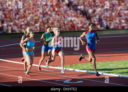 Runners racing on track Stock Photo