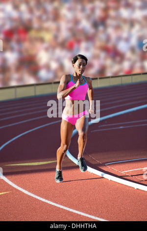 Runner racing on track Stock Photo