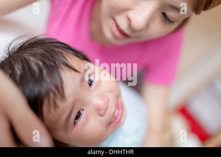 Mother pacifying crying baby Stock Photo