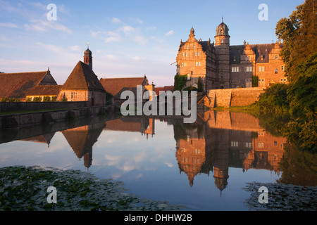 View over the pond onto Haemelschenburg castle, Emmerthal, Weser Hills, North Lower Saxony, Germany, Europe