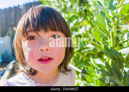 Girl in fava bean garden Stock Photo