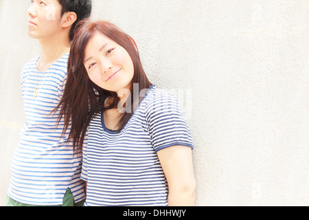 Portrait of young couple wearing striped top garments Stock Photo