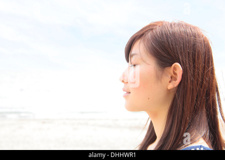 Profile of young woman with eyes closed Stock Photo